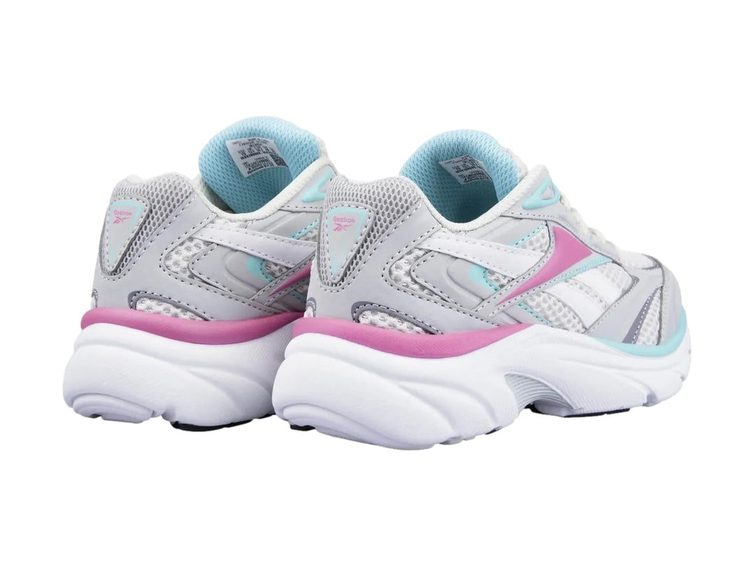 Tenis deportivos Reebok en color blanco y gris con detalles en rosa y azul claro.