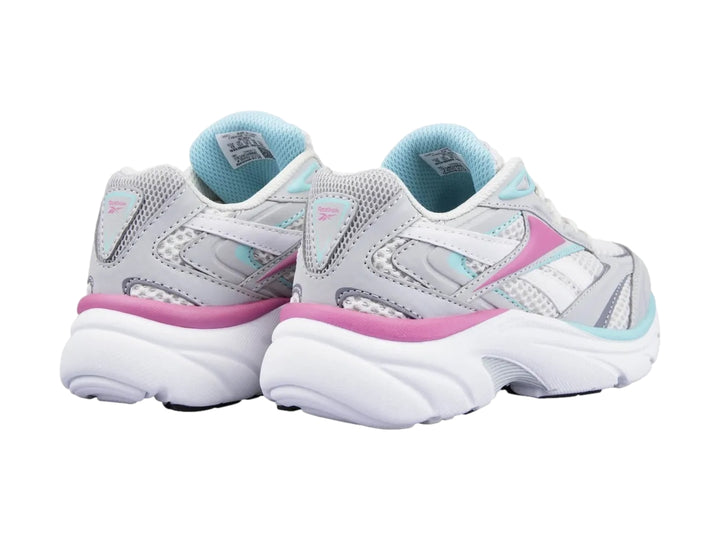Tenis deportivos Reebok en color blanco y gris con detalles en rosa y azul claro.