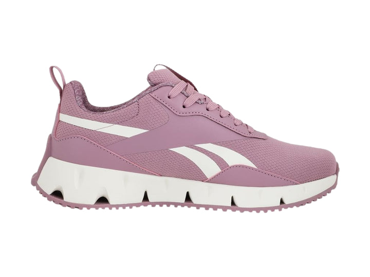 Tenis deportivos Reebok color rosa con suela blanca y detalles en blanco.