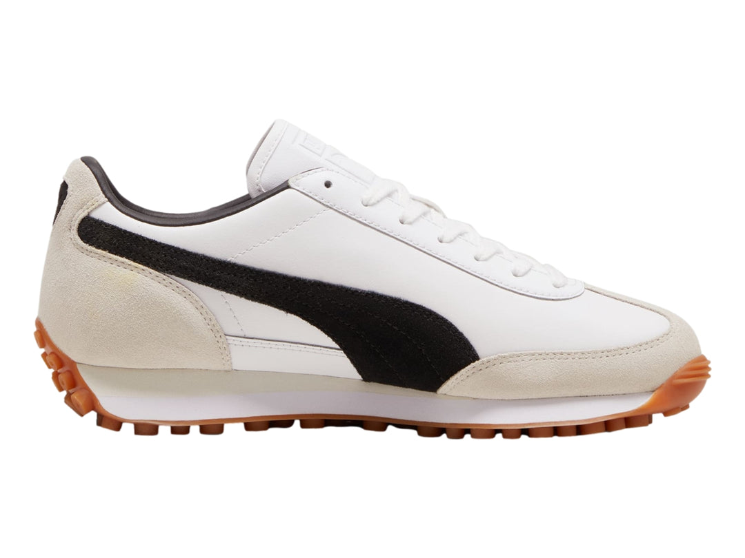 Tenis Puma Easy Rider Mix color blanco y negro con detalles en beige y suela color café.