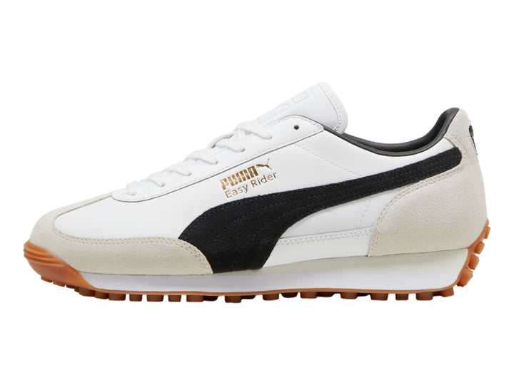 Tenis Puma Easy Rider Mix color blanco y negro con detalles en beige y suela color café.