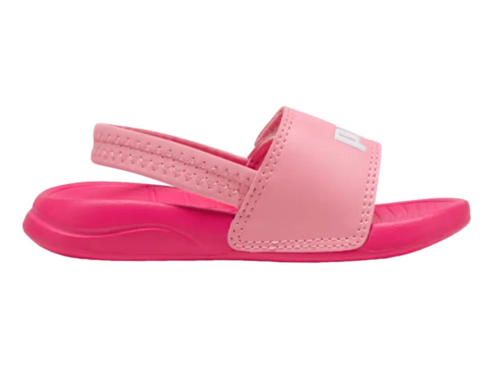Sandalia infantil PUMA de color rosa con correa trasera y logotipo blanco en la parte superior.