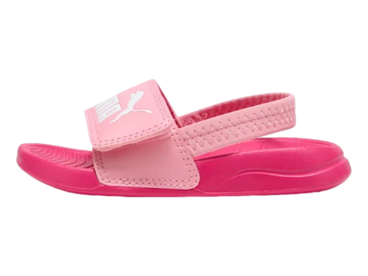 Sandalia infantil PUMA de color rosa con correa trasera y logotipo blanco en la parte superior.