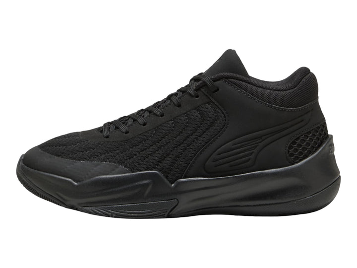 Tenis de baloncesto PUMA color negro para Niño, diseño deportivo con malla y suela robusta.