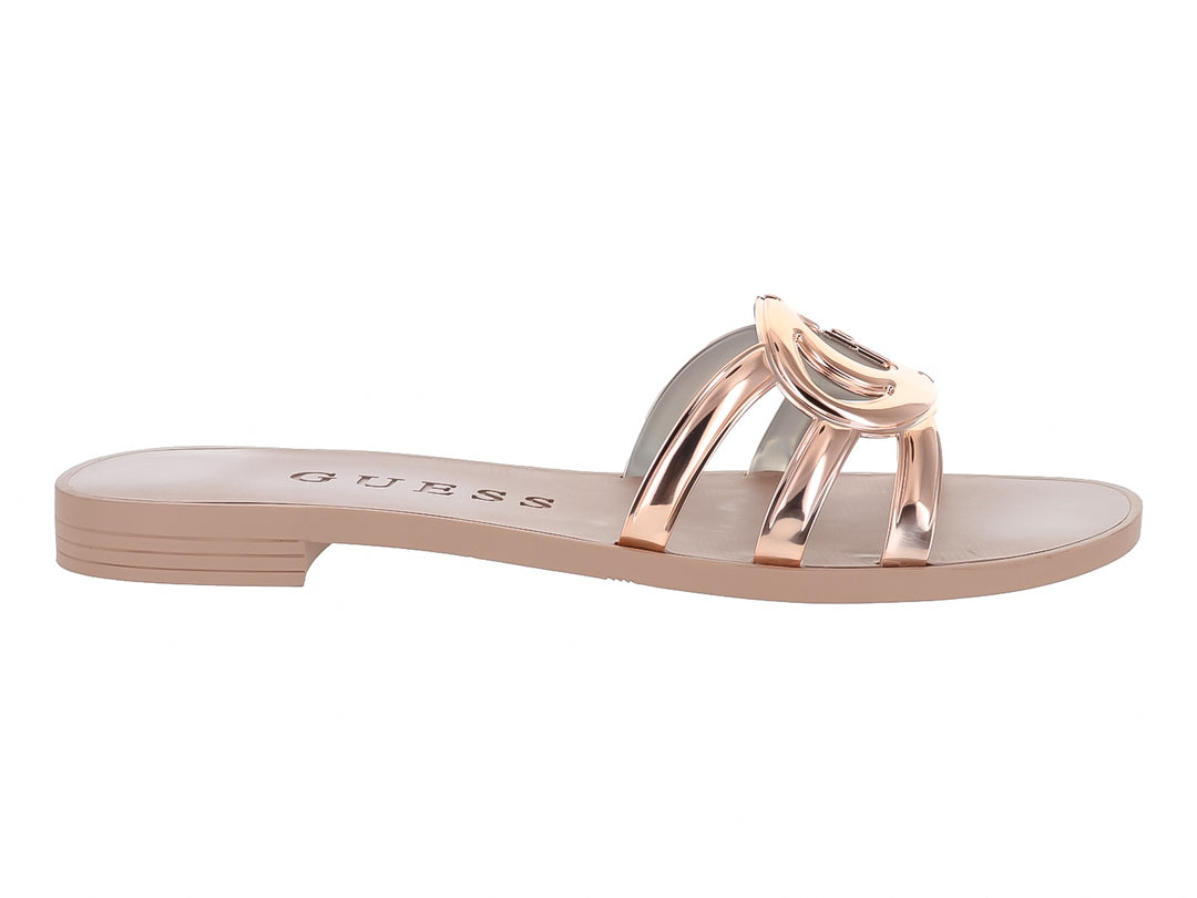 Sandalias planas Guess en color rose gold con tiras brillantes y suela plana.
