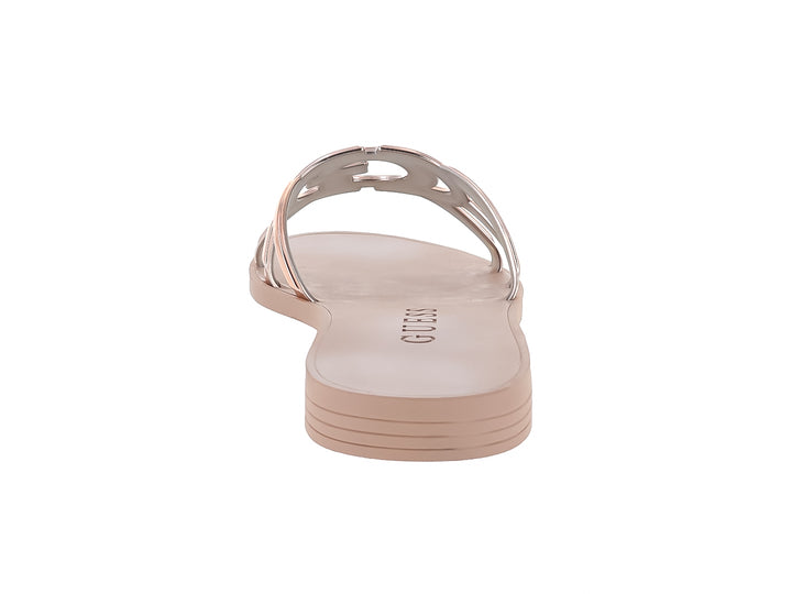 Sandalias planas Guess en color rose gold con tiras brillantes y suela plana.