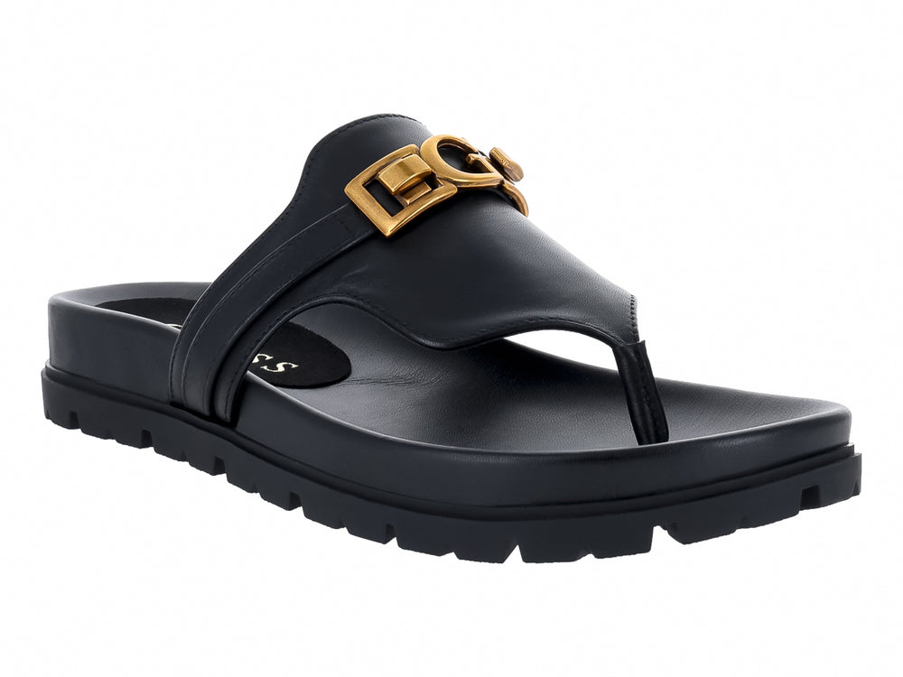 Sandalias negras de dedo GUESS con plataforma gruesa y hebilla dorada.