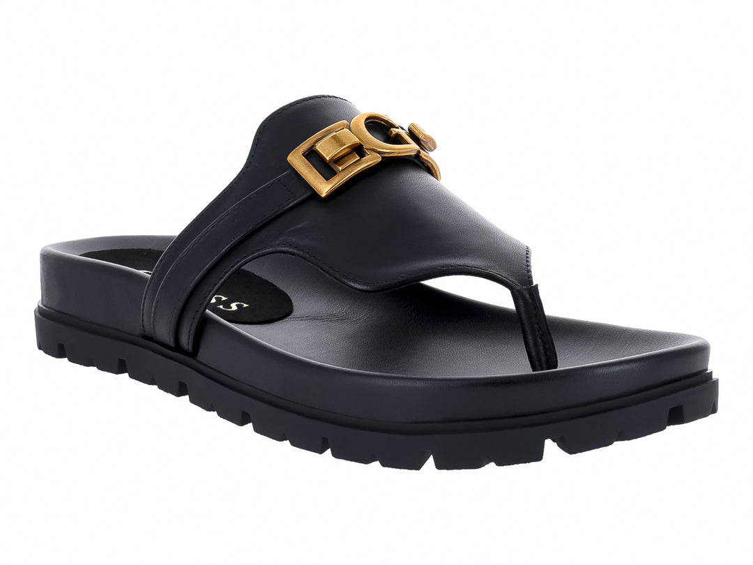 Sandalias negras de dedo GUESS con plataforma gruesa y hebilla dorada.