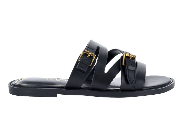 Sandalias planas negras con tiras y hebillas doradas de la marca GUESS.