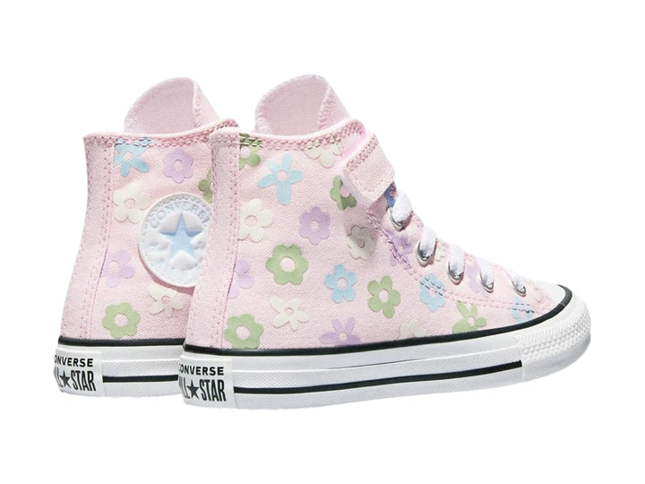 Tenis Converse rosa para niña con estampado de flores coloridas y suela blanca.