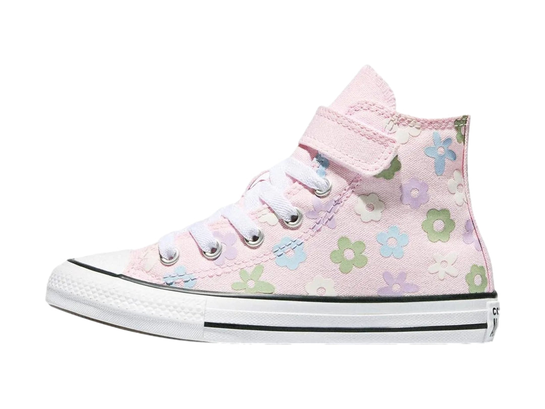 Tenis Converse rosa para niña con estampado de flores coloridas y suela blanca.