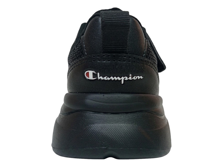 Tenis Champion Motion School color negro con cierre de velcro y suela gruesa sobre fondo blanco.