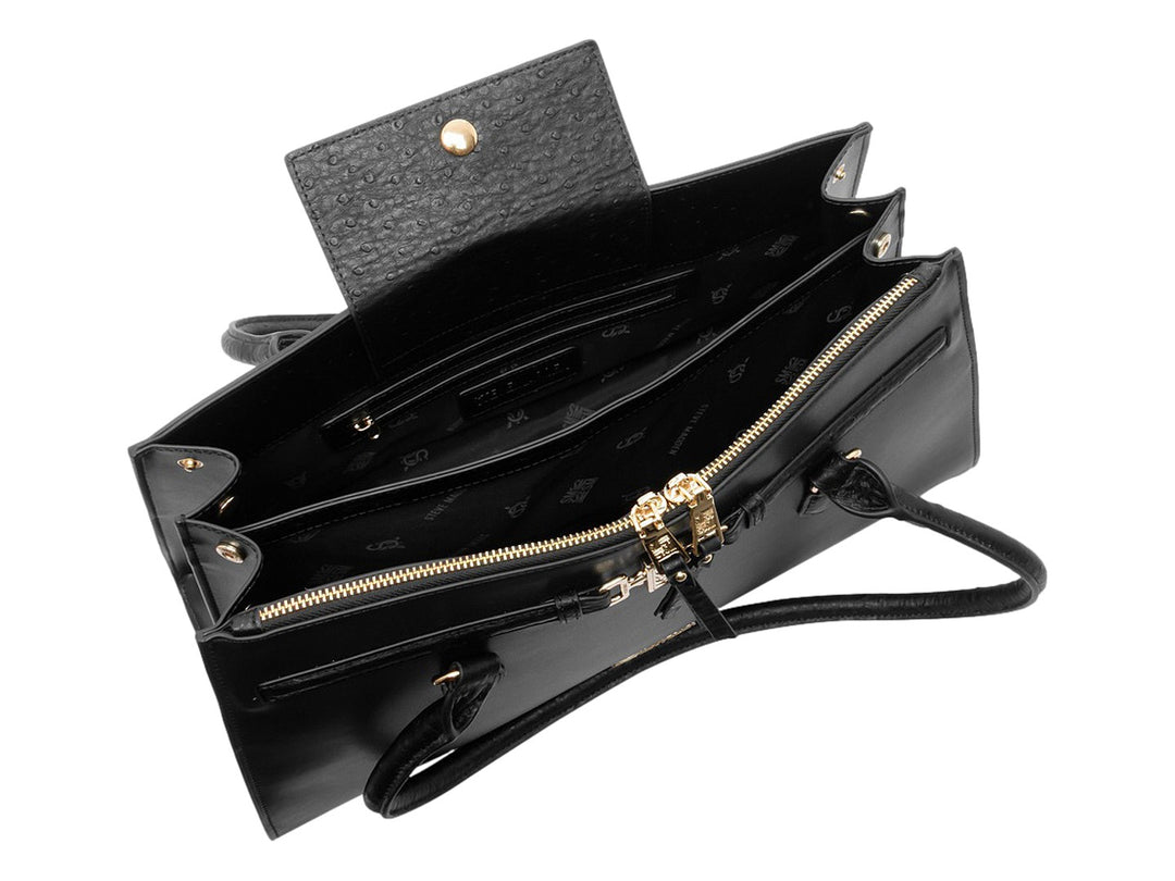 Bolso de mano Steve Madden color negro con detalles y herrajes en tono dorado.