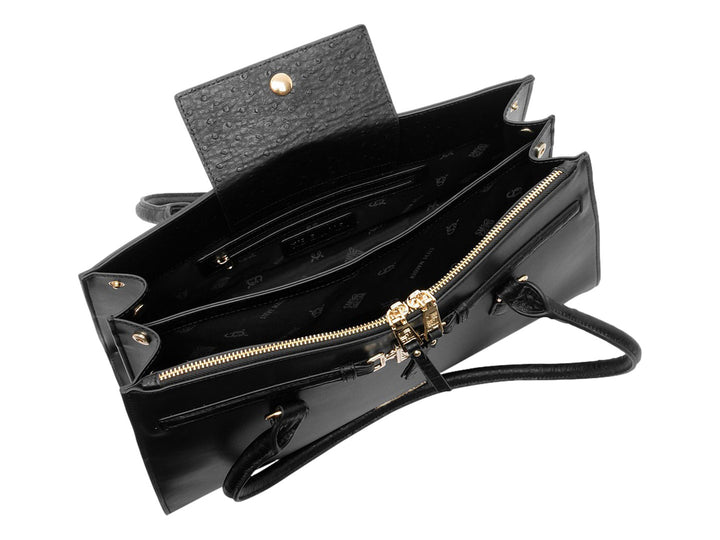 Bolso de mano Steve Madden color negro con detalles y herrajes en tono dorado.
