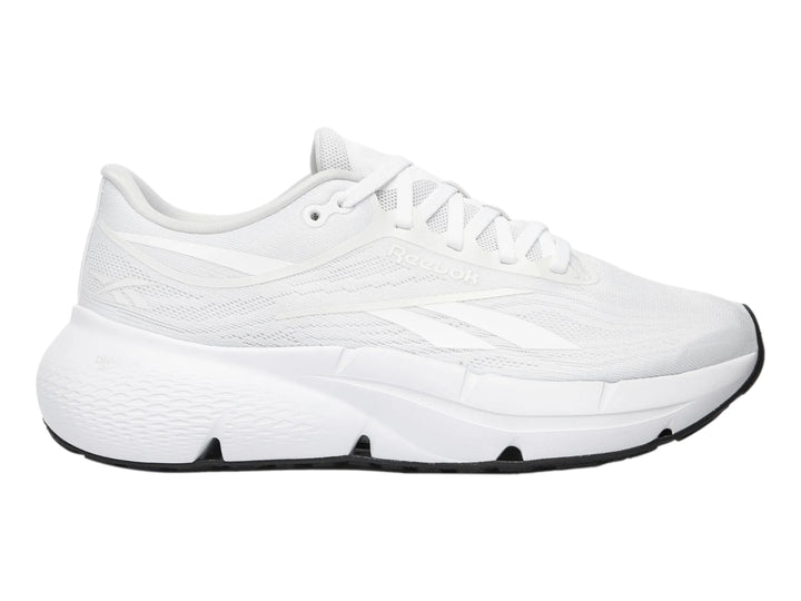 Tenis deportivos Reebok Zignition color blanco con suela negra para mujer.