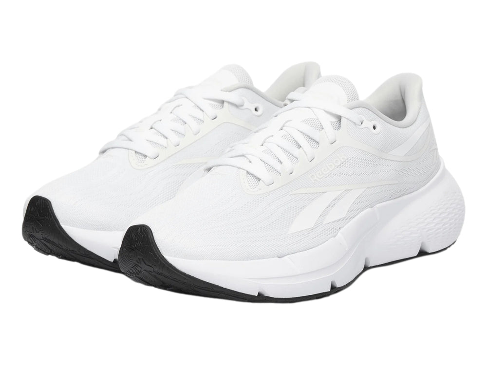 Tenis deportivos Reebok Zignition color blanco con suela negra para mujer.
