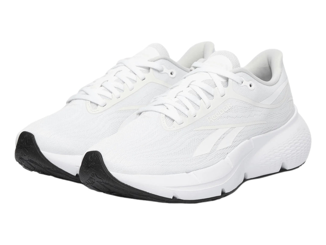 Tenis deportivos Reebok Zignition color blanco con suela negra para mujer.