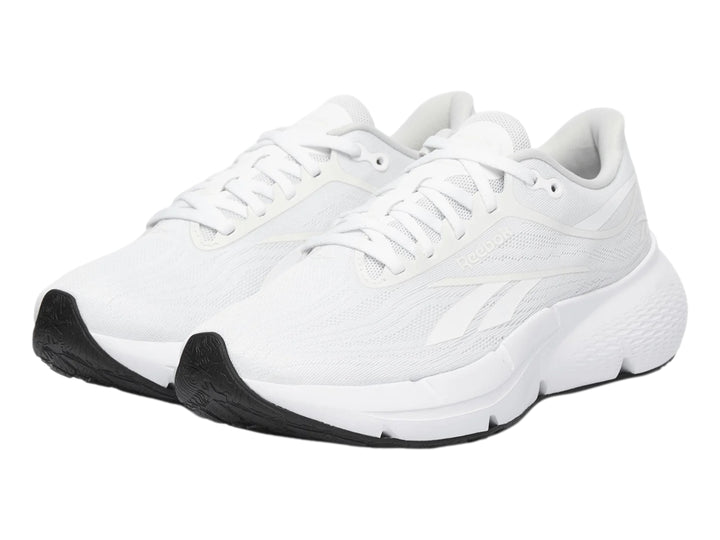 Tenis deportivos Reebok Zignition color blanco con suela negra para mujer.