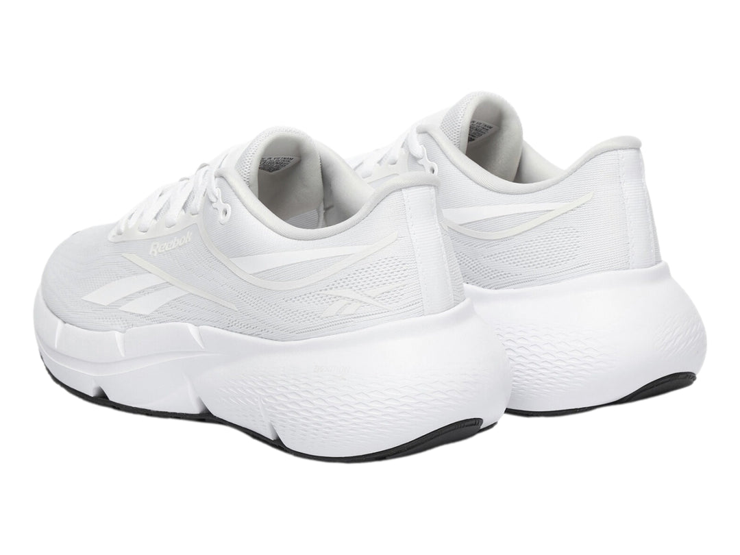 Tenis deportivos Reebok Zignition color blanco con suela negra para mujer.