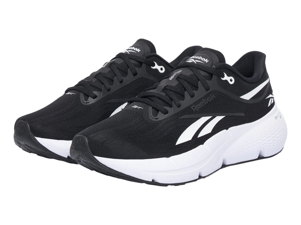 Tenis deportivos Reebok Zignition color negro con suela blanca y detalles laterales en blanco.