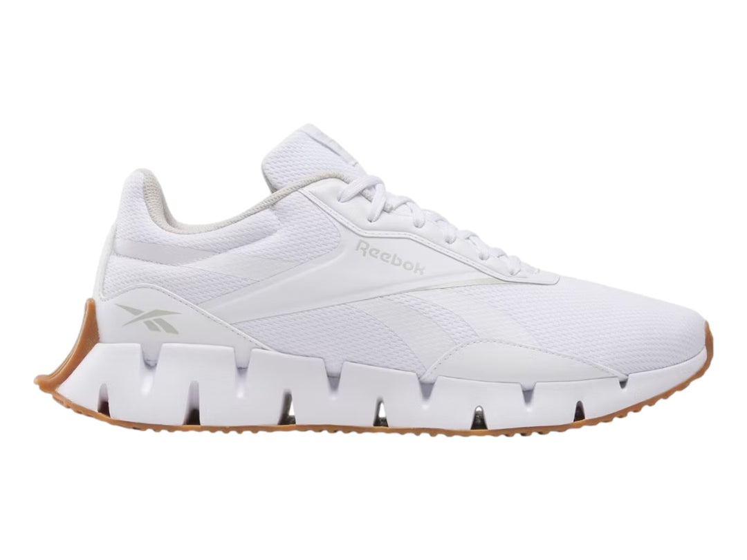 Tenis deportivos Reebok Zig Dynamica color blanco con suela café para mujer.