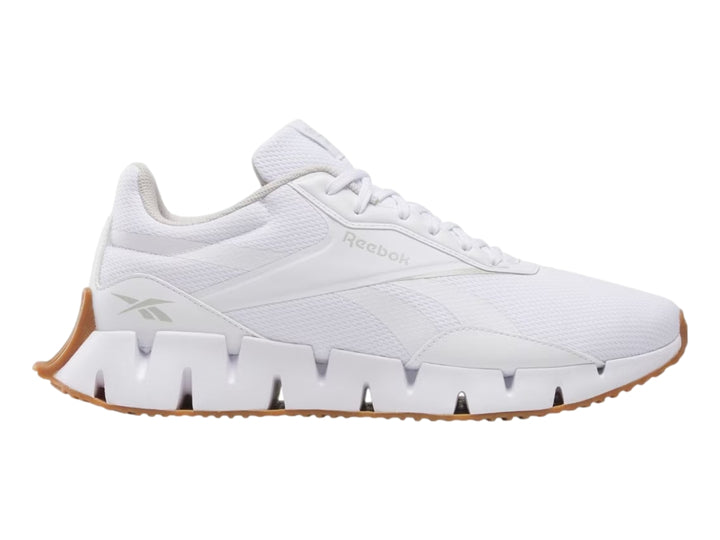 Tenis deportivos Reebok Zig Dynamica color blanco con suela café para mujer.