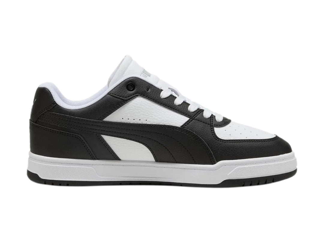 Tenis Puma Caven III para hombre en colores blanco y negro con suela blanca.