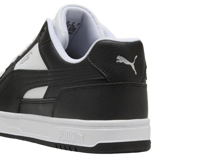 Tenis Puma Caven III para hombre en colores blanco y negro con suela blanca.