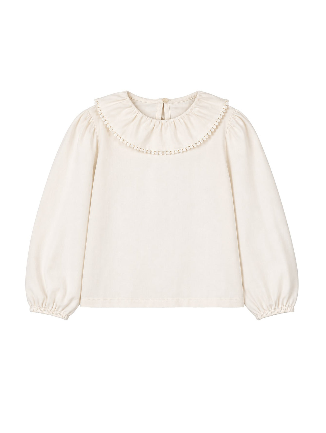Blusa Mayoral color soja para niña con cuello redondo adornado con encaje y mangas largas abullonadas.