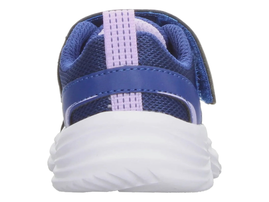 Tenis deportivos Skechers para Niña en color azul marino con detalles lavanda y suela blanca.