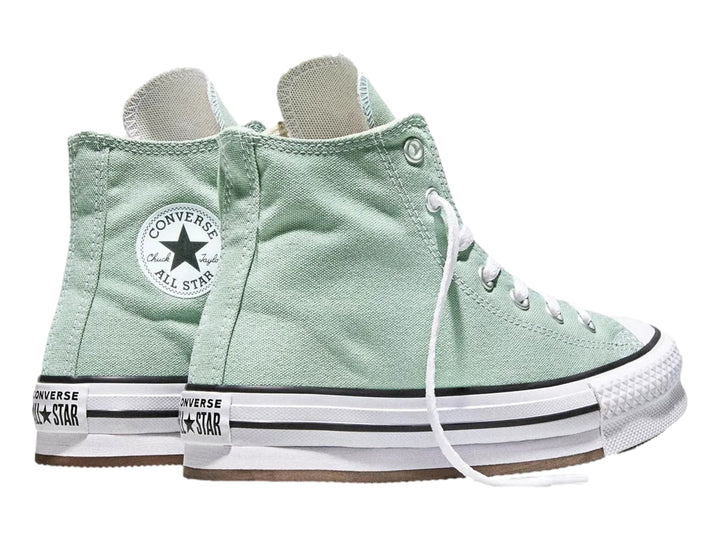 Tenis Converse de bota color verde con suela de plataforma blanca para niña.