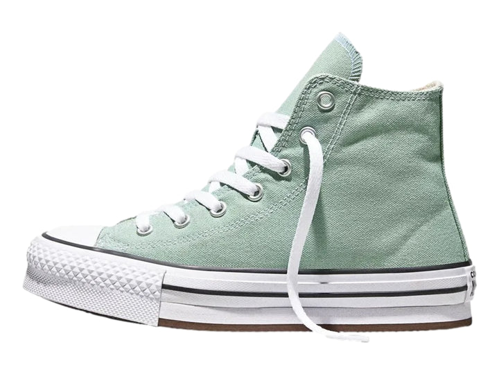 Tenis Converse de bota color verde con suela de plataforma blanca para niña.