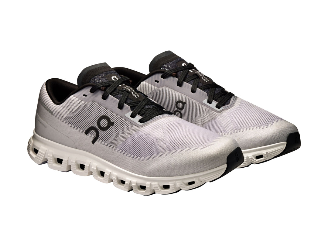 Tenis deportivos On Cloud 6 Push color lila con detalles negros y suela blanca para hombre.