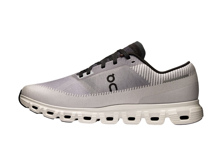 Tenis deportivos On Cloud 6 Push color lila con detalles negros y suela blanca para hombre.
