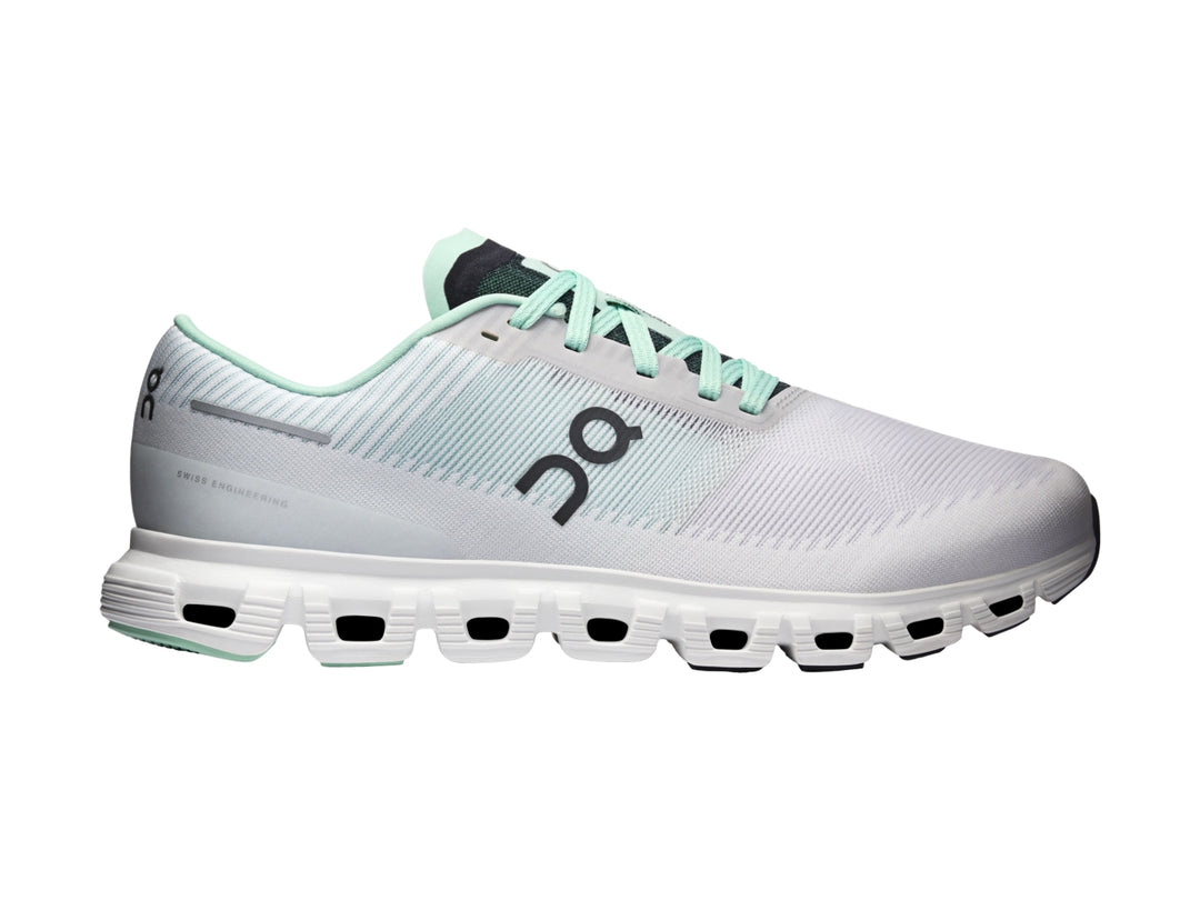 Tenis deportivos On Cloud 6 Push color blanco y azul claro con suela blanca y detalles negros.