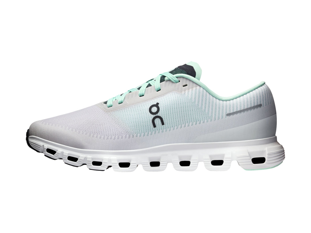 Tenis deportivos On Cloud 6 Push color blanco y azul claro con suela blanca y detalles negros.