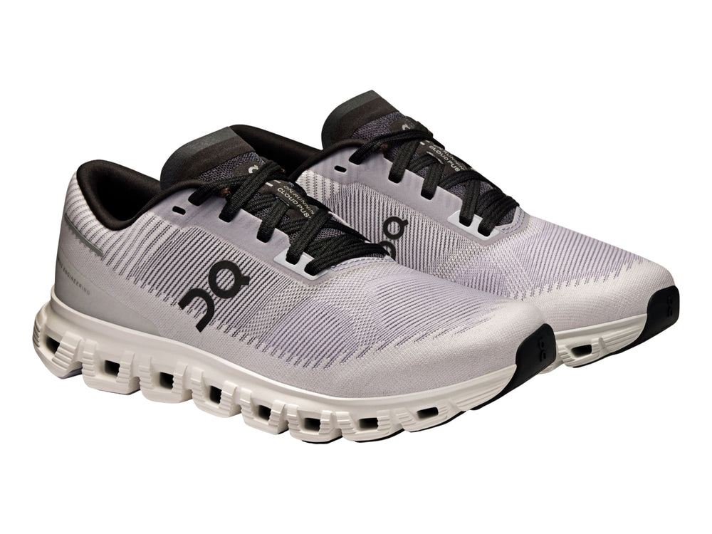 Tenis deportivos On Cloud color lila con suela blanca y detalles en negro para mujer.