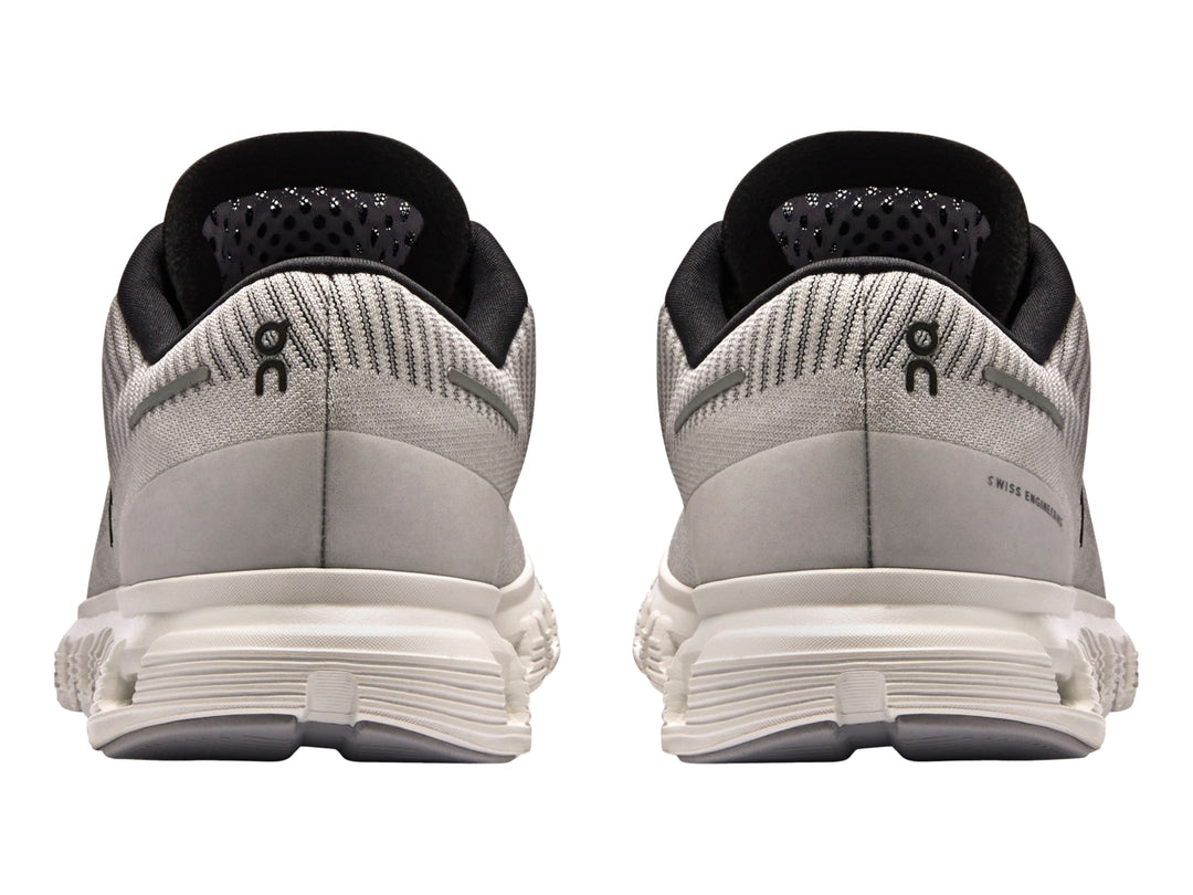 Tenis deportivos On Cloud color lila con suela blanca y detalles en negro para mujer.