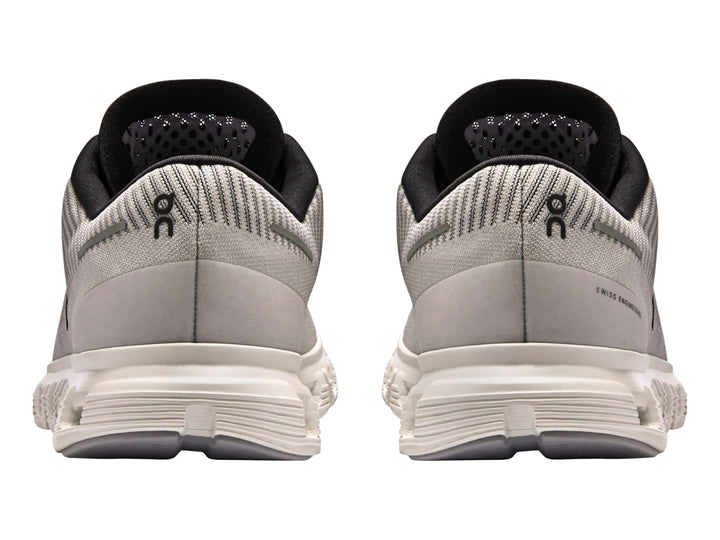 Tenis deportivos On Cloud color lila con suela blanca y detalles en negro para mujer.