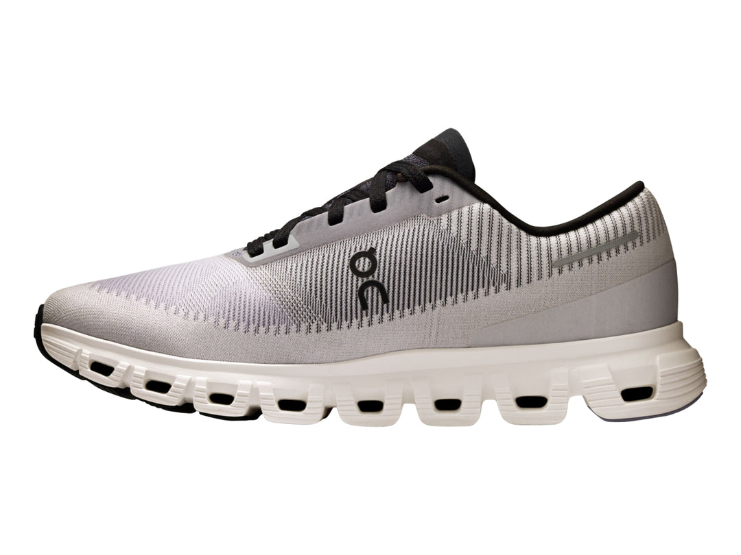 Tenis deportivos On Cloud color lila con suela blanca y detalles en negro para mujer.