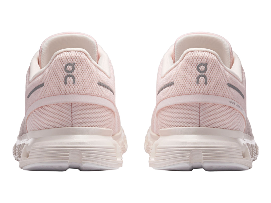 Tenis deportivos On Cloud 6 color rosa claro y blanco para mujer con suela amortiguada.