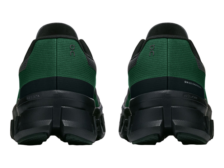 Tenis deportivos On Cloud Cloudmonster en color negro con un detalle lateral en color verde