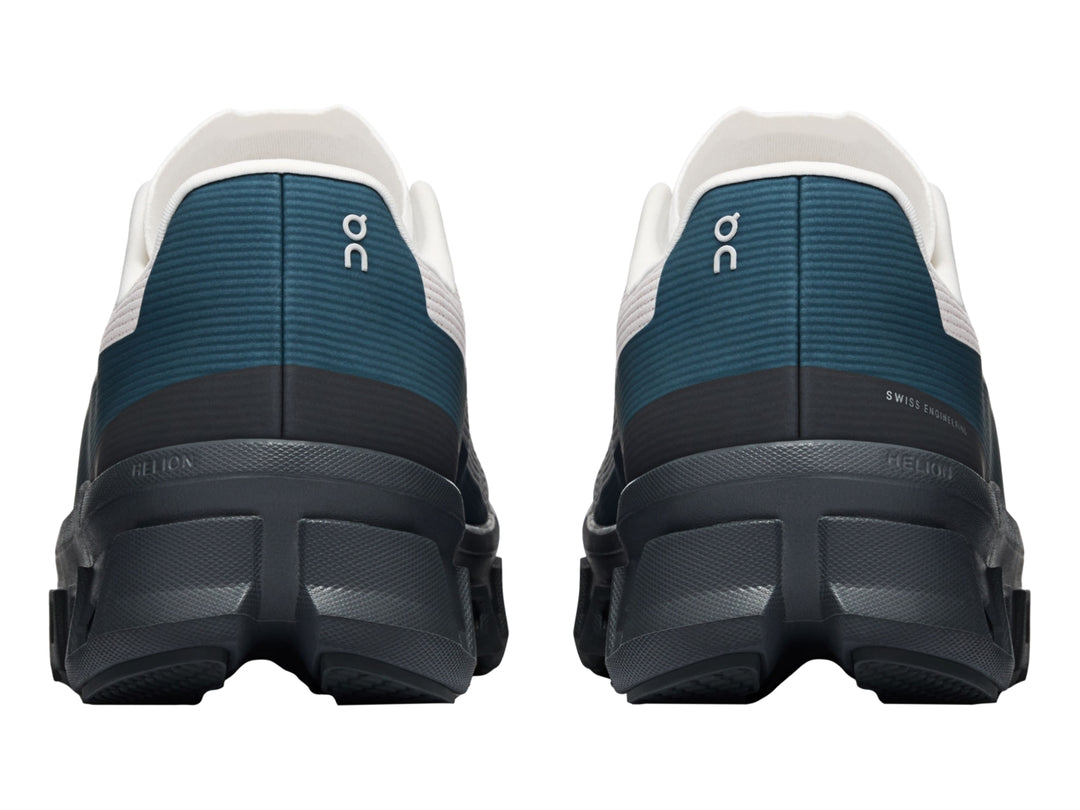 Tenis On Cloud Cloudmonster Void color plata y gris oscuro con detalles azules y suela CloudTec.