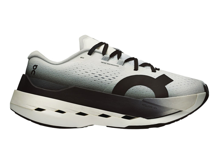 Tenis deportivos On Cloud Cloudboom Max para mujer en colores blanco y negro con suela gruesa.