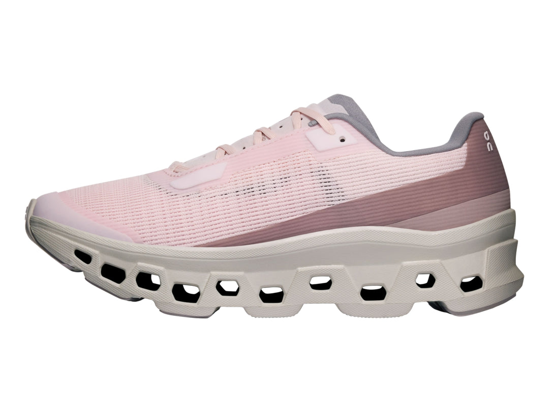Tenis deportivos On Cloud Cloudmonster Void para mujer en color rosa pálido y blanco hueso.