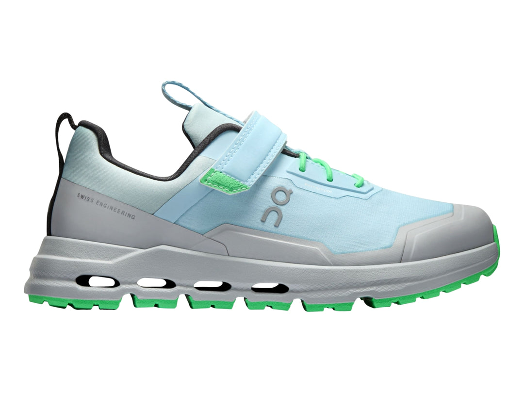 Tenis deportivos On Cloud Cloudhero para niño en color azul glaciario y gris con detalles en verde neón.