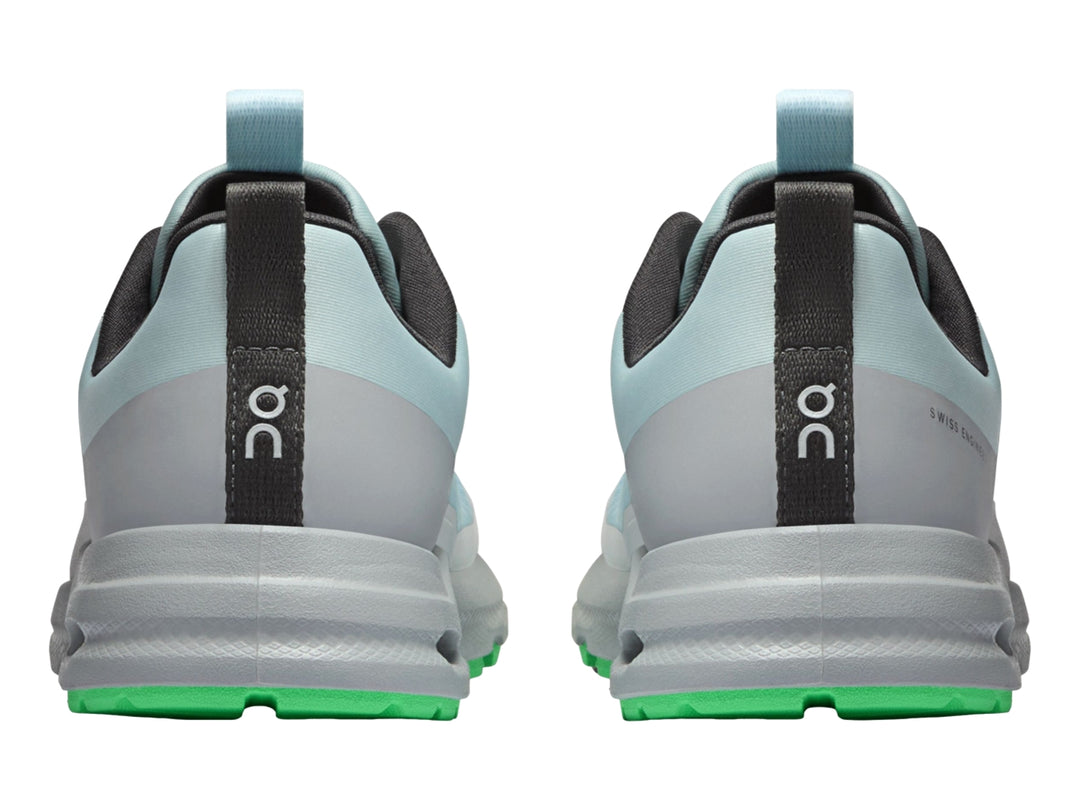 Tenis deportivos On Cloud Cloudhero para niño en color azul glaciario y gris con detalles en verde neón.
