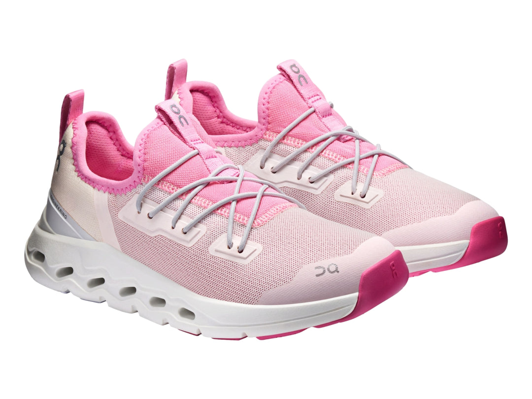 Tenis deportivos On Cloud Cloudleap para niña en color rosa y blanco con suela blanca.
