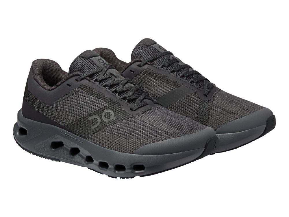 Tenis deportivos On Cloud Cloudsurfer Youth en color negro y gris oscuro para niño.