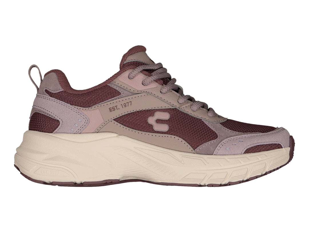 Tenis Charly Fashion Sport color morado con suela gruesa en tono beige.